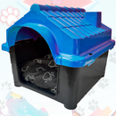Casa de plástico azul e preta para pets com almofada de patinhas dentro
